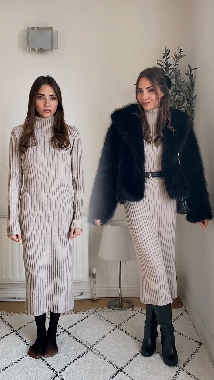 Two women posing in beige ribbed turtleneck sweater dresses indoors against a white wall.