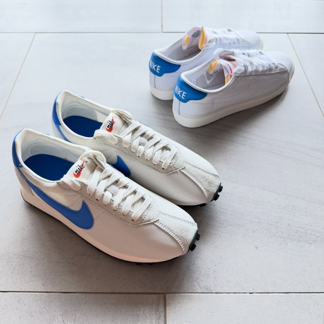Three pairs of low-profile athletic sneakers resting on a light grey tiled floor.